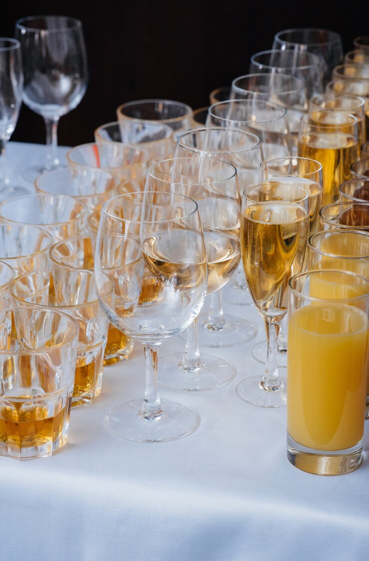 Festive glasses on the festive table during the Banquet. Alcoholic beverage.