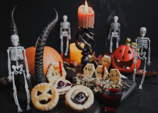 Festive Halloween cakes with gingerbread tombstone.