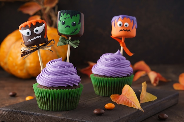 Festive Halloween cupcakes decorated with funny marshmallows