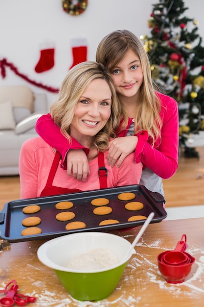 Festive little girl making christmas cookies