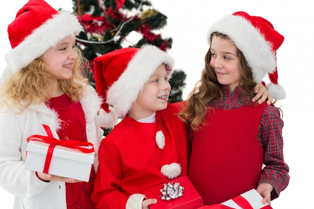 Festive little siblings holding gifts