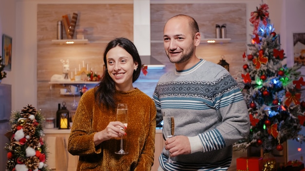 Festive man and woman using video call conference