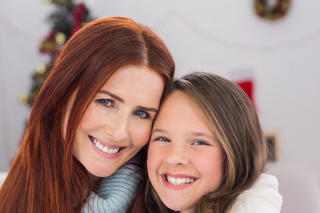 Festive mother and daughter on the couch