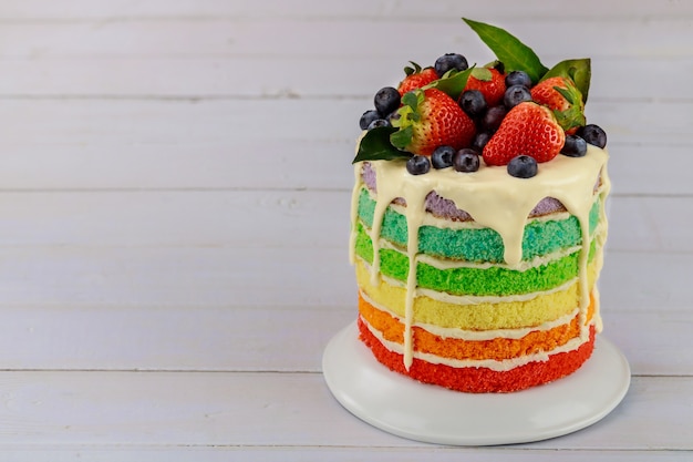 Festive multi layered cake with fresh strawberry.