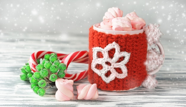 A festive New Year's cup with hot coffee and marshmallow