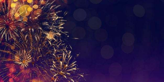 Festive new years fireworks in the dark night sky banner for website with copy space for text