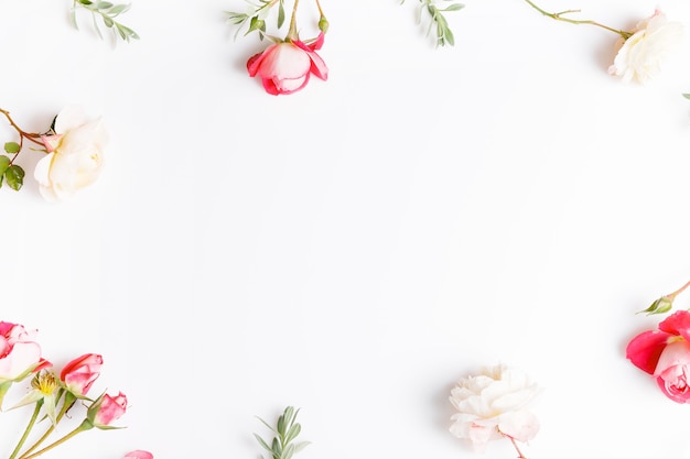 Festive pink flower English rose composition on the white background. Overhead top view, flat lay. Copy space. Birthday, Mother's, Valentines, Women's, Wedding Day concept.