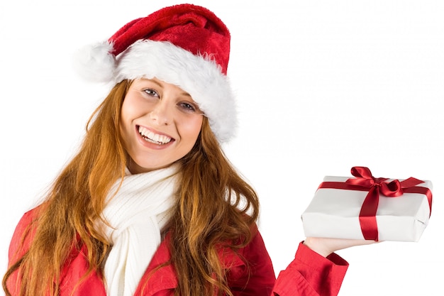 Festive redhead holding a gift