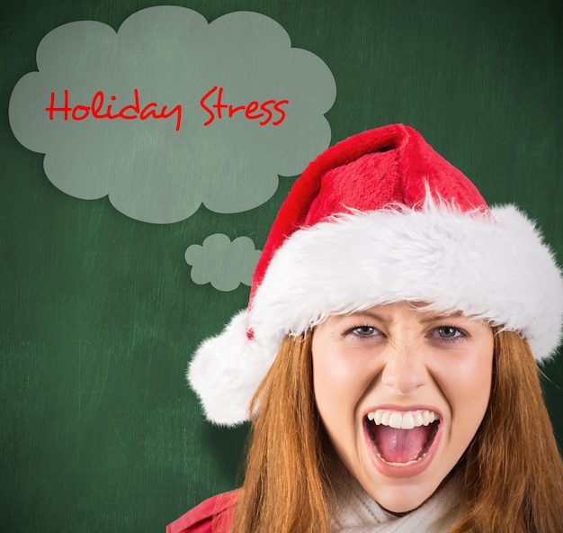 Festive redhead shouting at camera against green chalkboard