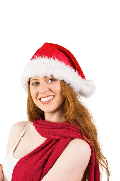 Festive redhead smiling at camera