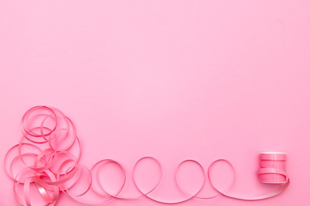 Festive ribbon  on pink background