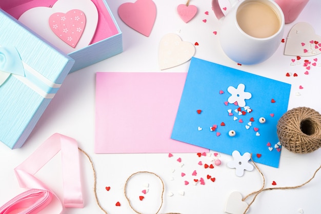 Festive romantic background for Valentine's day in pastel pink and light blue tones. Envelopes