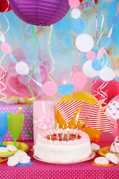 Festive table setting for birthday on celebratory decorations