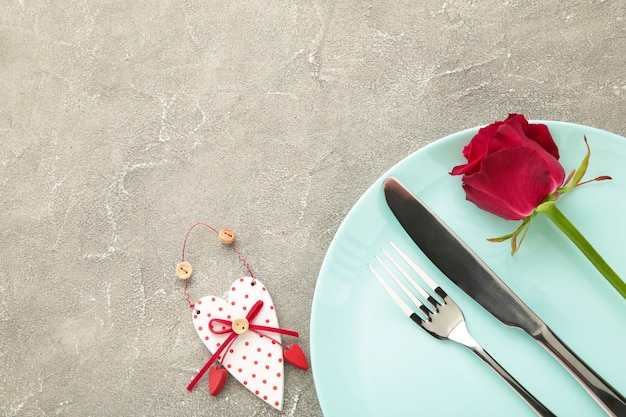 Festive table setting for Valentines Day on grey