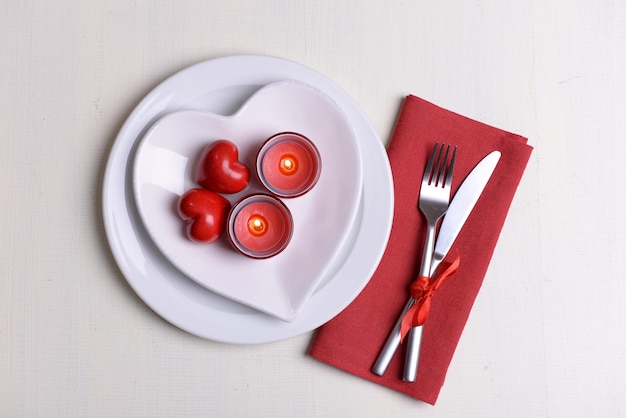 Festive table setting for Valentines Day on light background