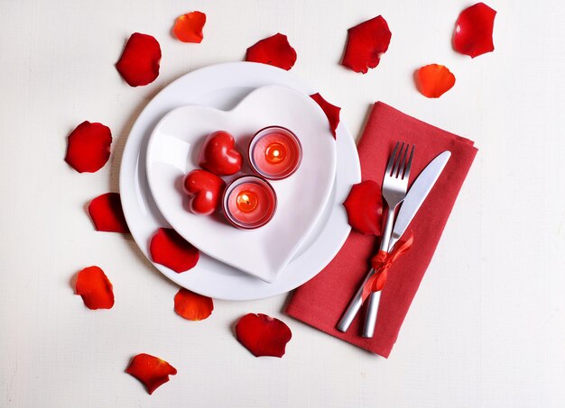 Festive table setting for Valentines Day on light background