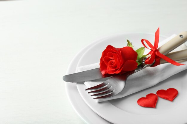 Festive table setting for Valentines Day on light background