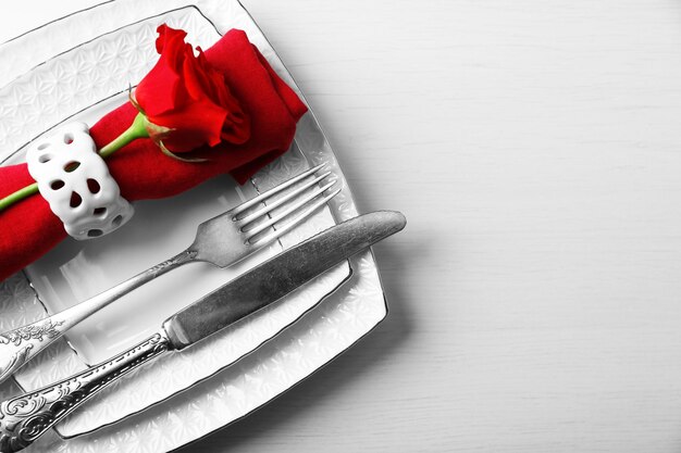 Festive table setting for Valentines Day on light background