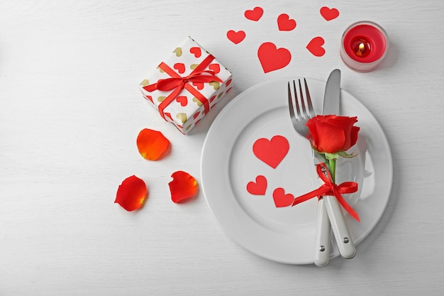 Festive table setting for Valentines Day on light background