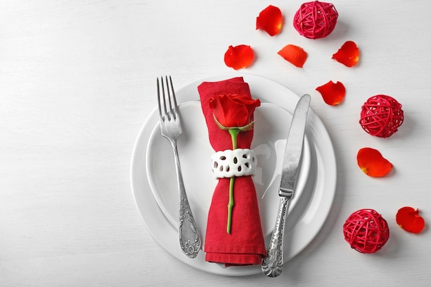 Festive table setting for Valentines Day on light background