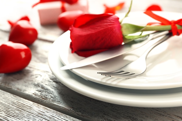 Festive table setting for Valentines Day on wooden table
