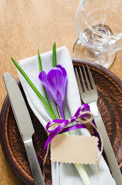 Festive Table Setting With Flower and Empty Tag.