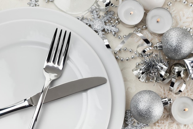 Festive table setting with silver cutlery