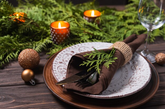 Festive table setting with winter decor christmas or new year holiday background