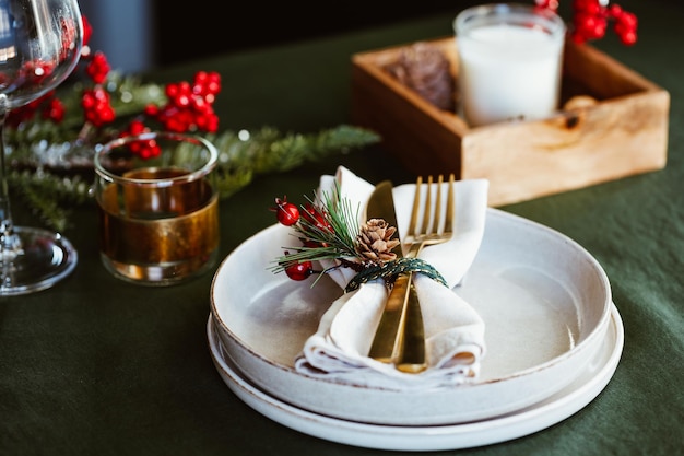 Festive table setting with winter decor The concept of Thanksgiving or Christmas family dinner