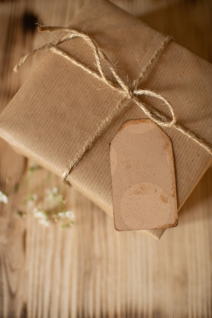 festively wrapped gift in kraft paper with a tag for wishes