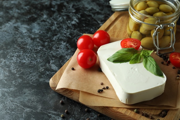 feta cheese on black smokey surface