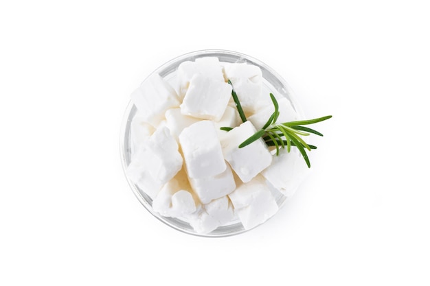 Feta cheese cucumber and herbs in a bowl isolated on white background