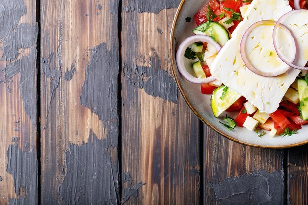 Feta cheese salad in ceramic bowl