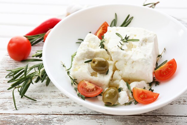 Feta cheese on wooden table