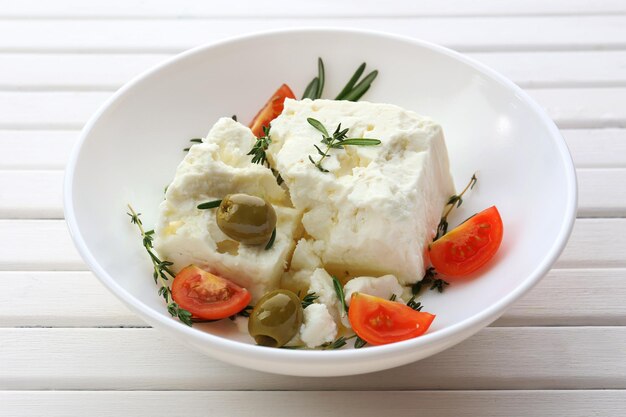 Feta cheese on wooden table