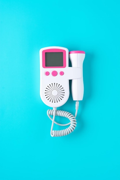 Fetal doppler on blue background