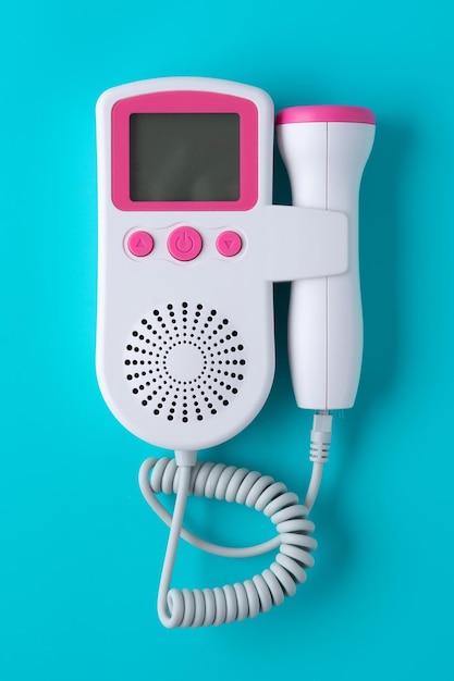 Fetal doppler on blue background