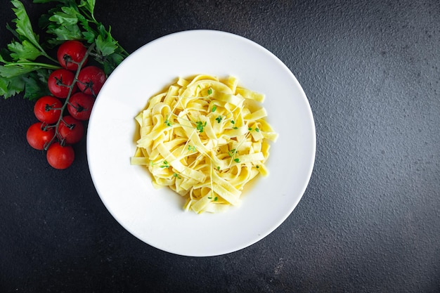 Fettuccine pasta or Tagliatelle creamy parmesan sauce healthy meal food diet snack on the table