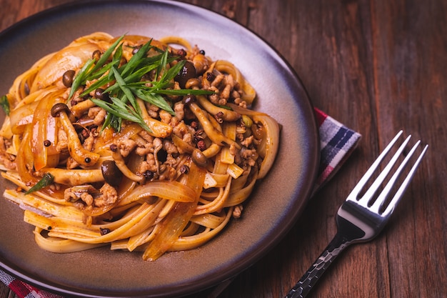 Fettuccine stir fry with Chinese sichuan pepper sauce with mince pork, mushroom and onion