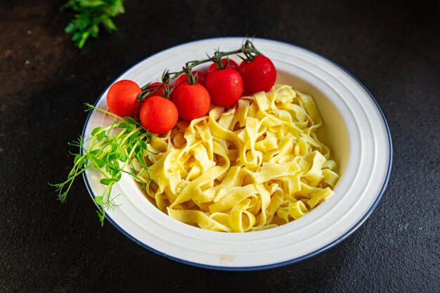 Fettuccine or tagliatelle pasta macaroni meal snack on the table copy space food background rustic