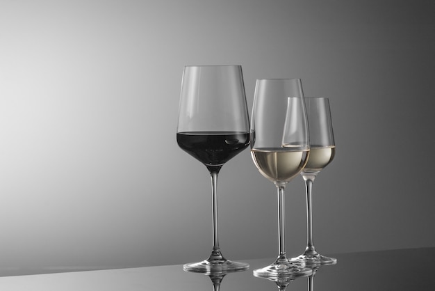 A few glasses of wine on a light background