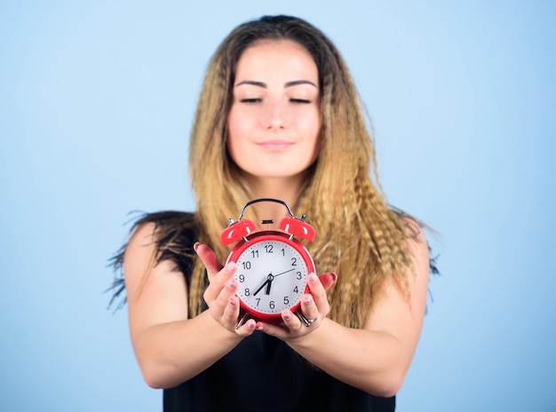 Few minutes Time management Punctuality and discipline Pretty girl managing her time Woman hold red alarm clock Counting time till deadline Overwork or being late It is time Watch repair