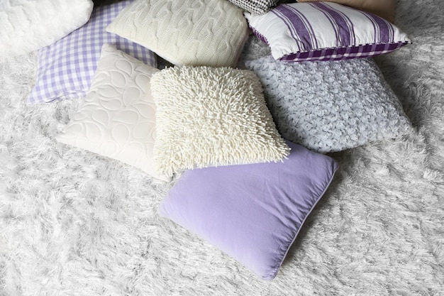 Few pillows on light carpet