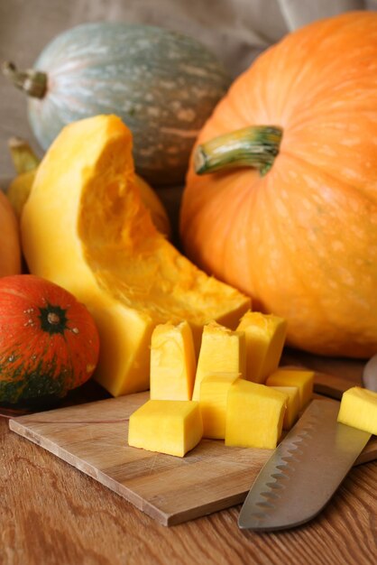 Few pumpkin cutting harvest on wooden table