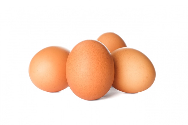 Few raw chicken eggs on white