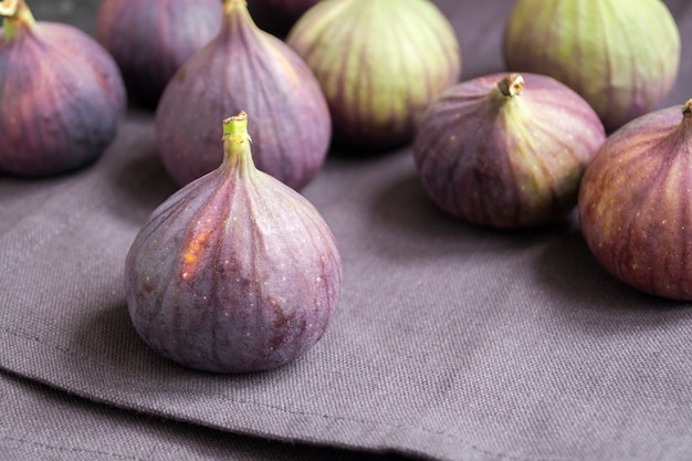 A few ripe figs on a dark 