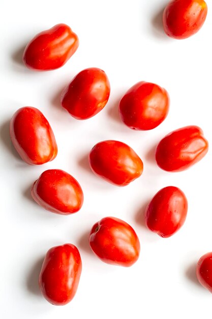 A few tomatoes closeup on white background