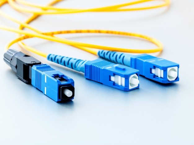 Photo fiber optics connectors symbolic photo for fast internet connection .