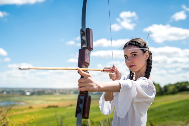 Fictional Native American Indian  woman with a bow and arrows. lifestyle