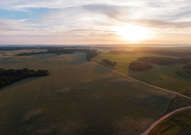 Fields and forests at sunset